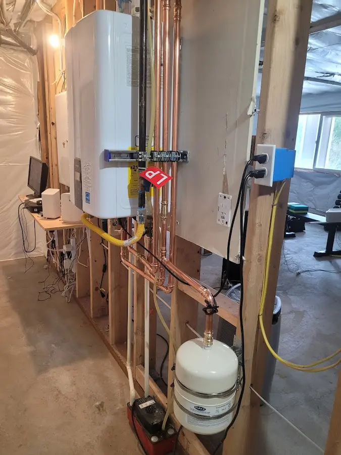 Licensed plumber repairing a kitchen sink in Brewer