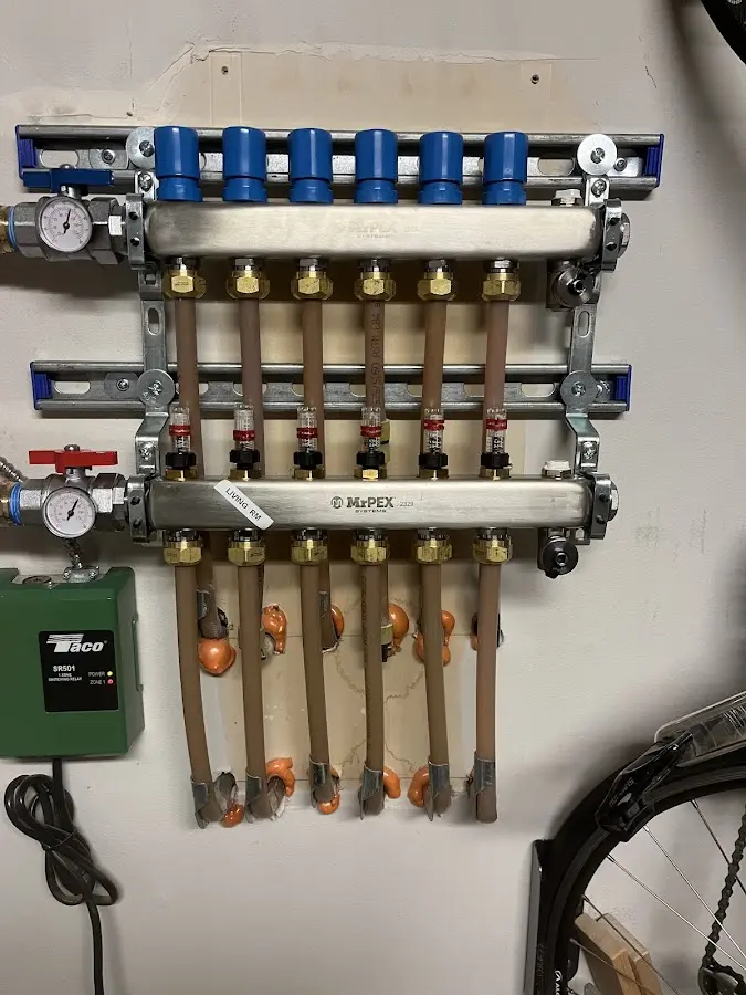 Plumber performing Water Heater Repair at a residential property in Brewer